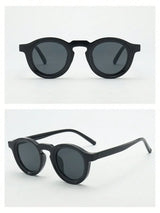 Black round sunglasses on a white background