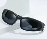 Black sunglasses with dark lenses on a white background