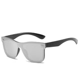 Sunglasses with black frame and silver reflective lenses on a white background